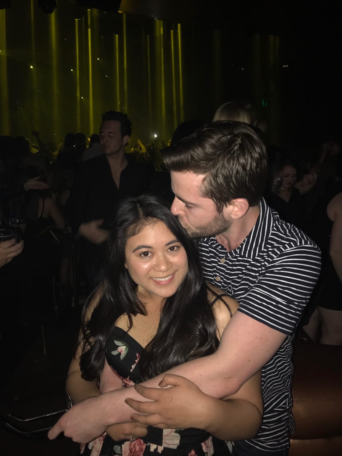 A kiss on the head at a concert