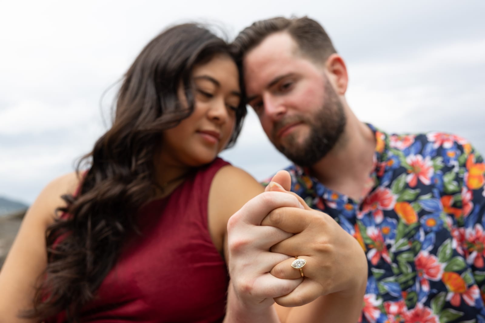 Holding hands, the engagement ring in focus